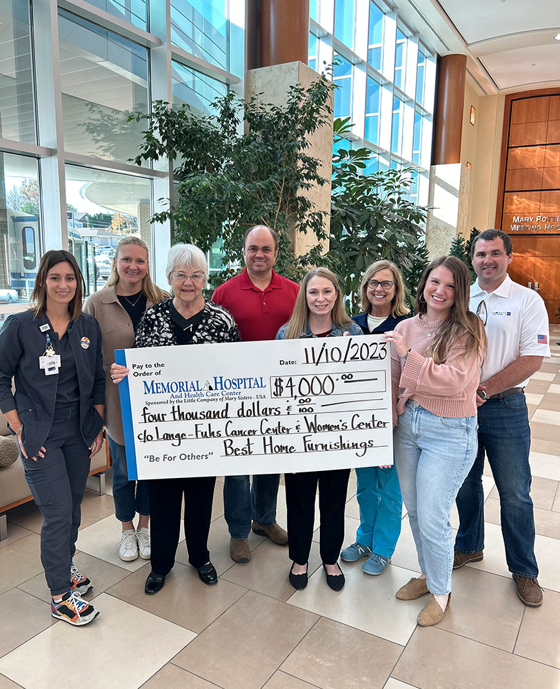 Best Presents Check to Memorial Hospital Foundation